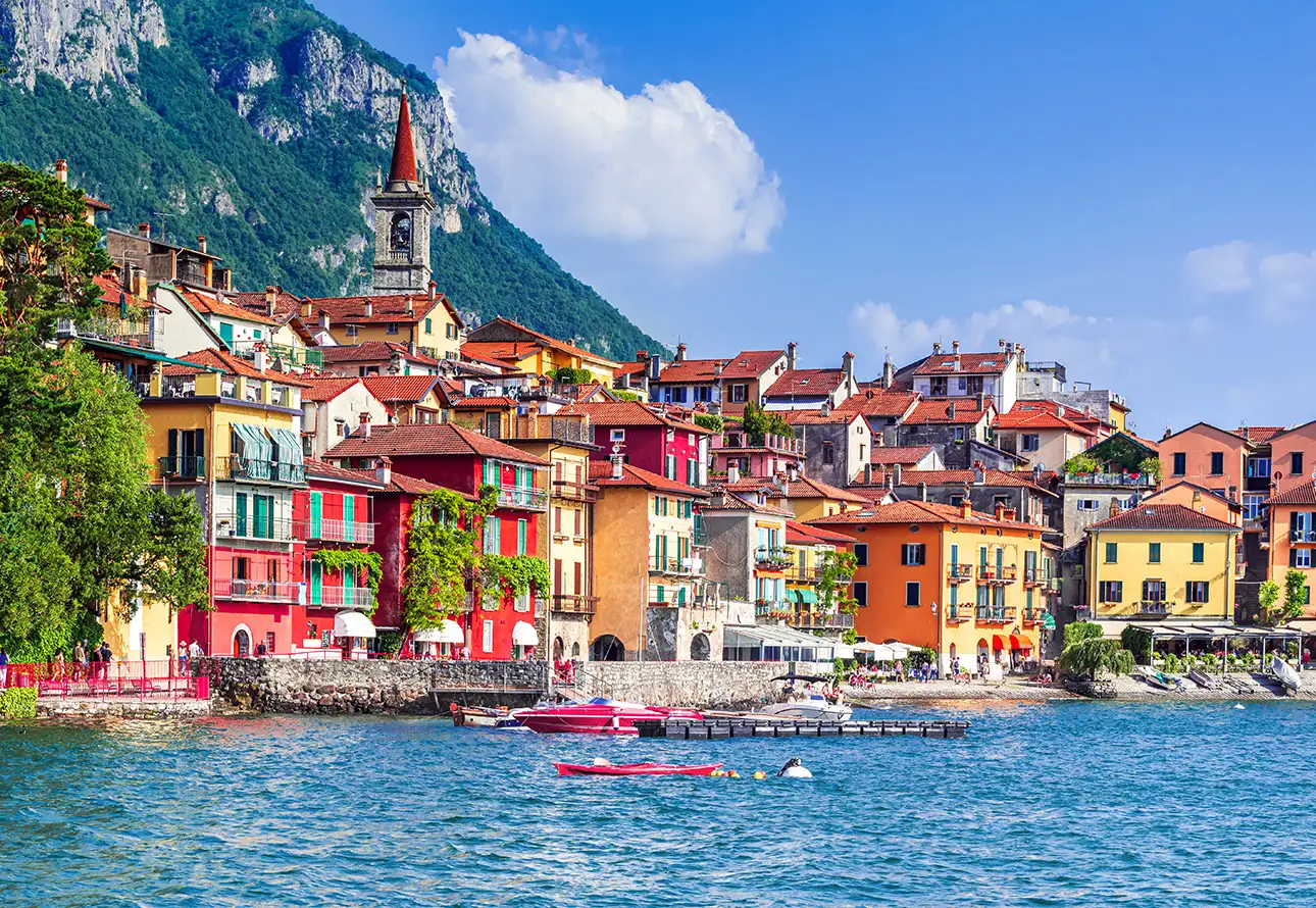 Picturesque Varena Lake with vibrant buildings and boats